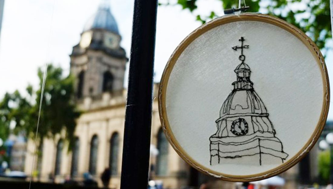 insite-embroidery-web An emboidery ring hangs on the railings outside Birmingham Cathedral, the embroidery shows the clocktower of the same cathedral.