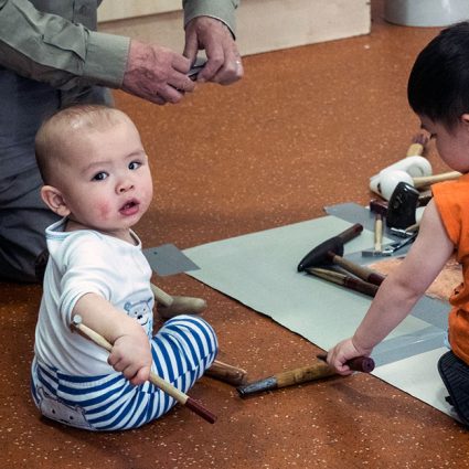 metal3 A baby uses a jeweller's hammer.