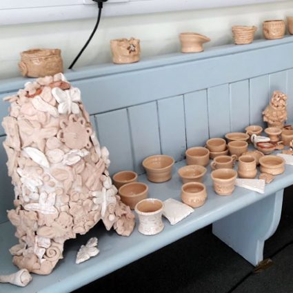 10 A display of clay items made during workshops.