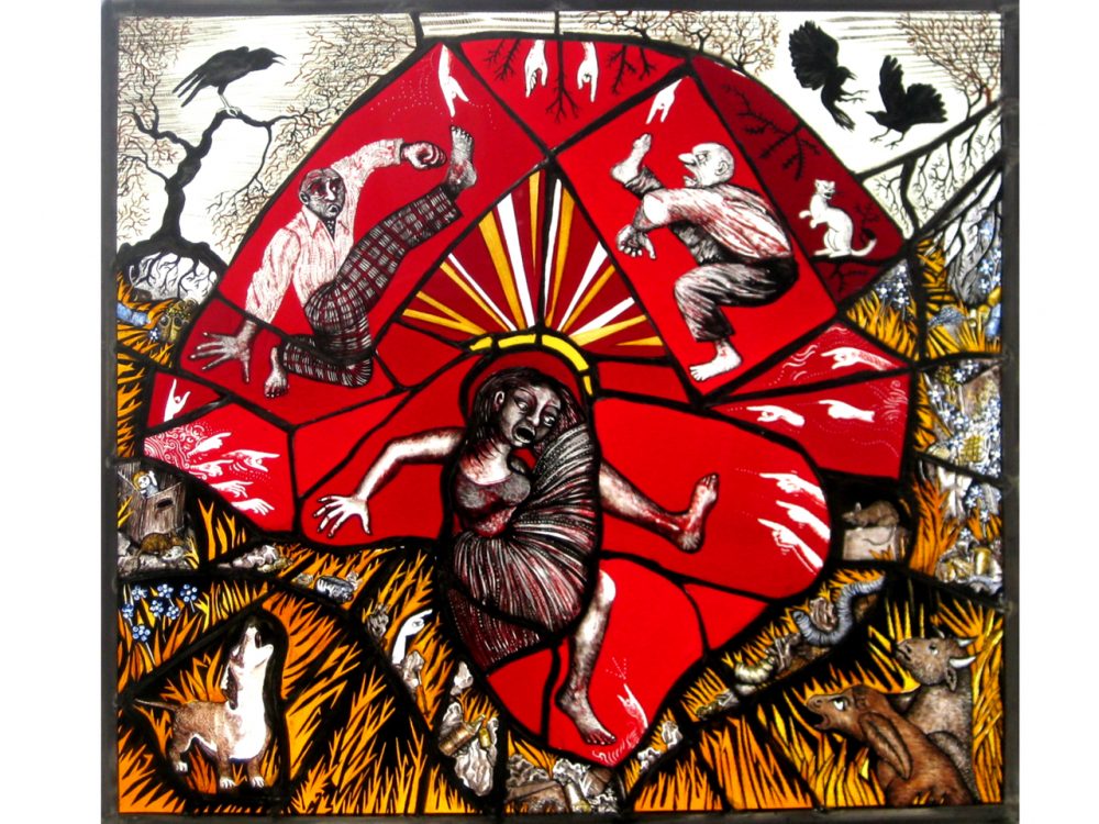 An intricate stained glass window - animals surround the outside of the piece, with three humans at the central.