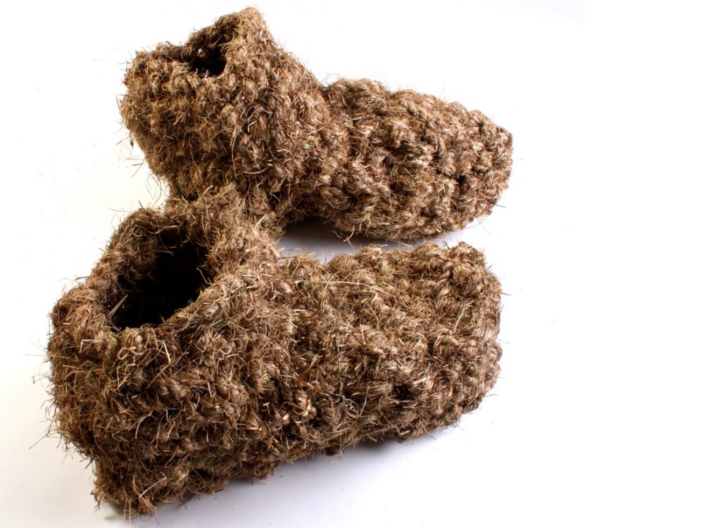 A pair of boots made from grass.
