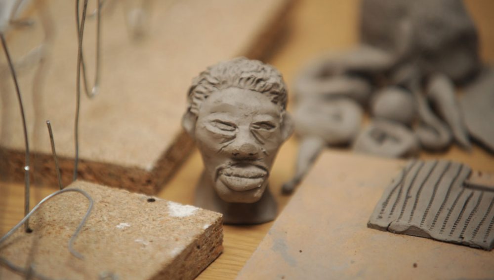 A face modelled out of a small amount of clay.