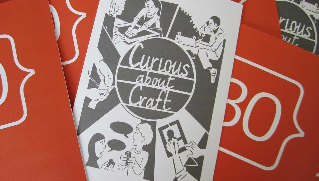 A paper leaflet featuring a design for a papercut featuring people making.