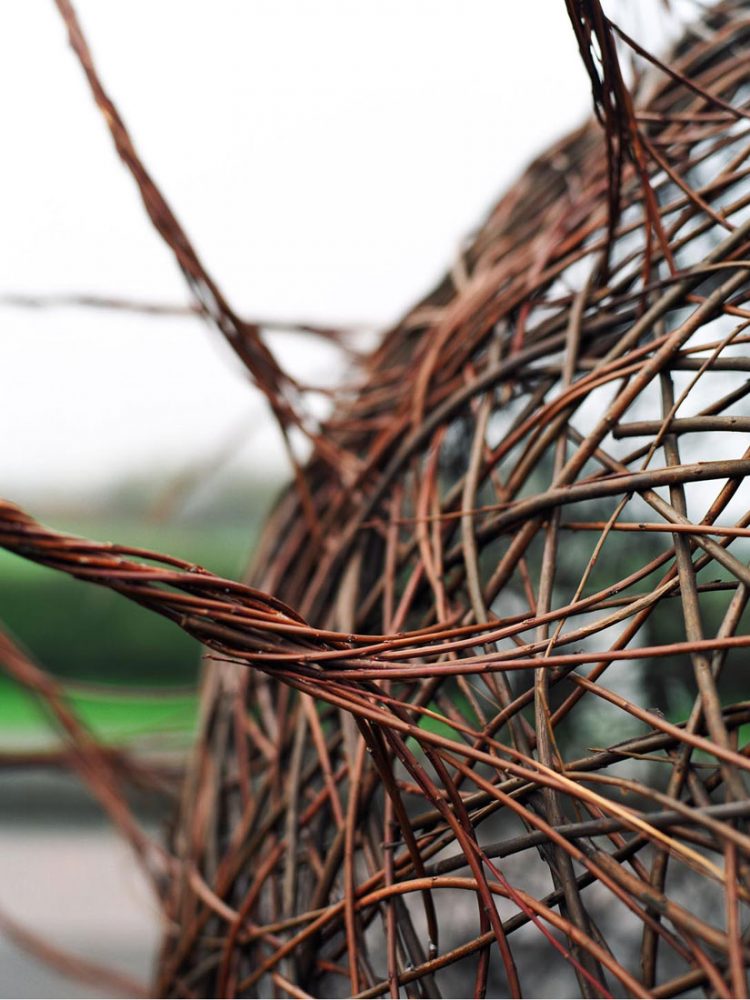 A detailed close up of a willow sculpture.