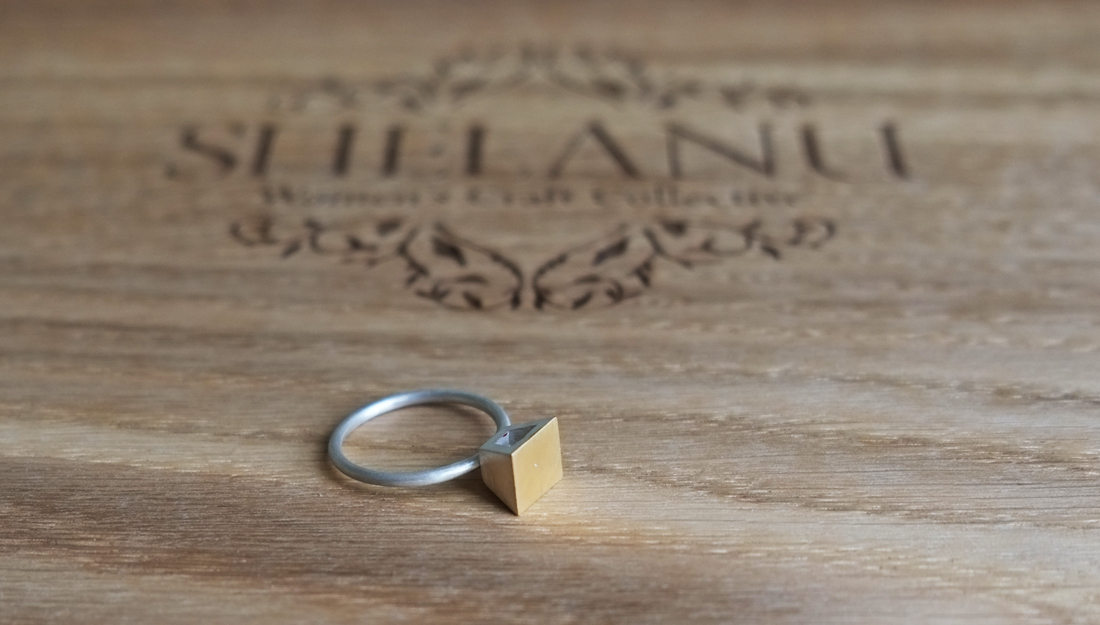 Shelanu Interlocking Stories range ring in part gold, simple square stud design.