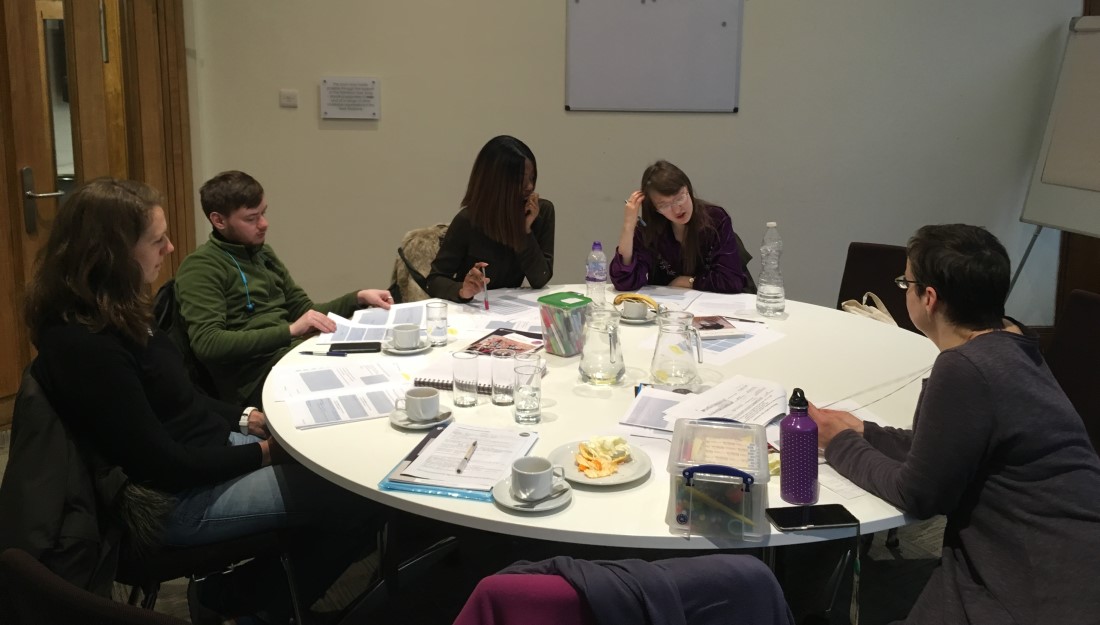 craft fellows sitting around a circle table