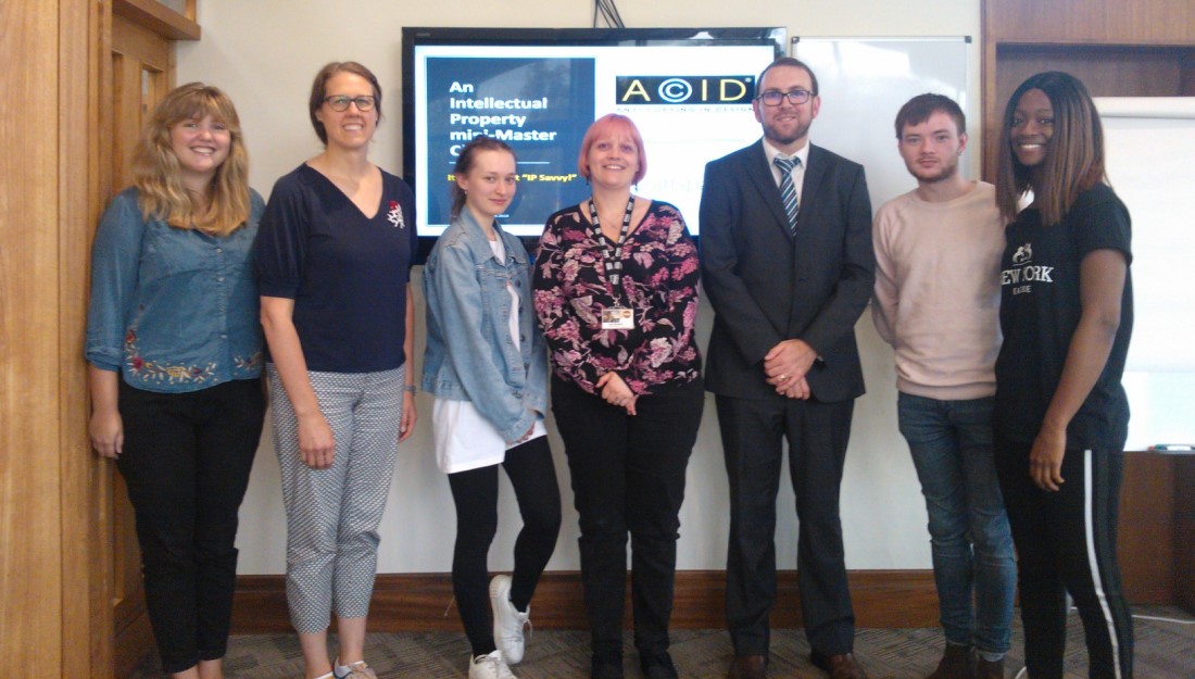 Group of Craft Fellows standing together with representatives of ACID.