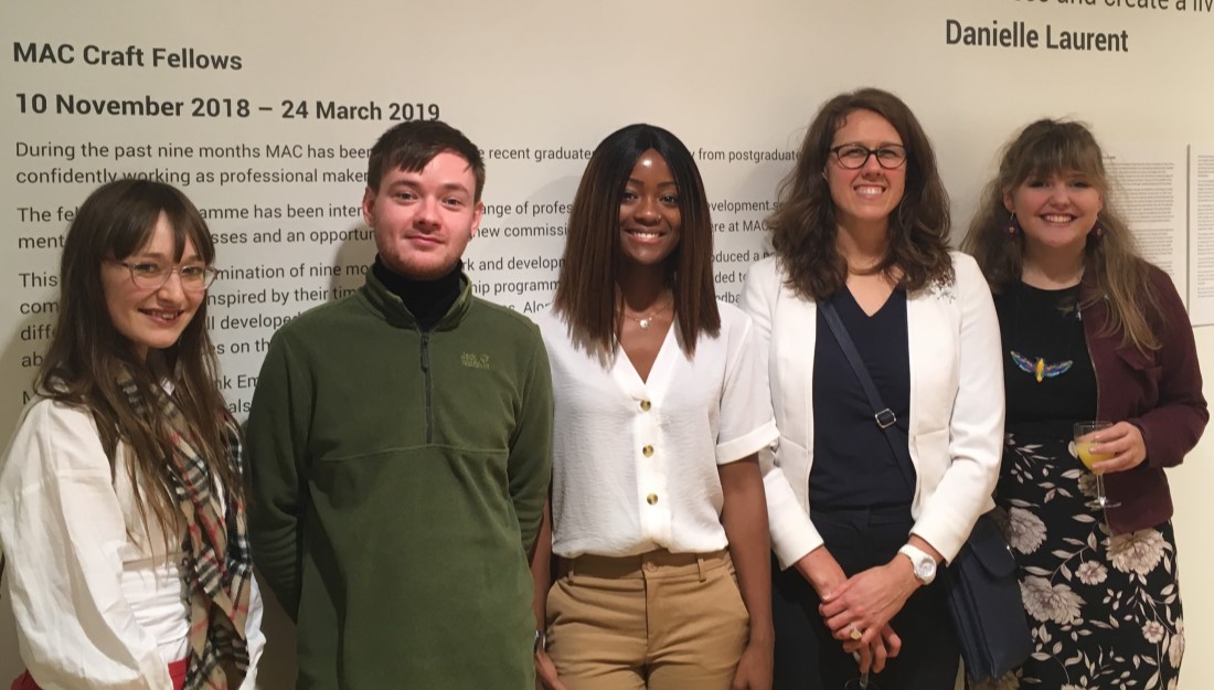 group of craft fellows standing together at their exhibition launch