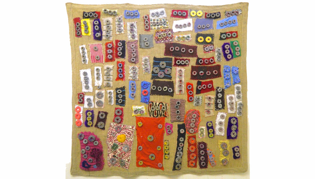 textile artwork with colourful rectangles and circles