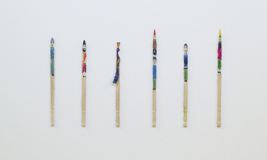 painted toothpicks as persons and peacock