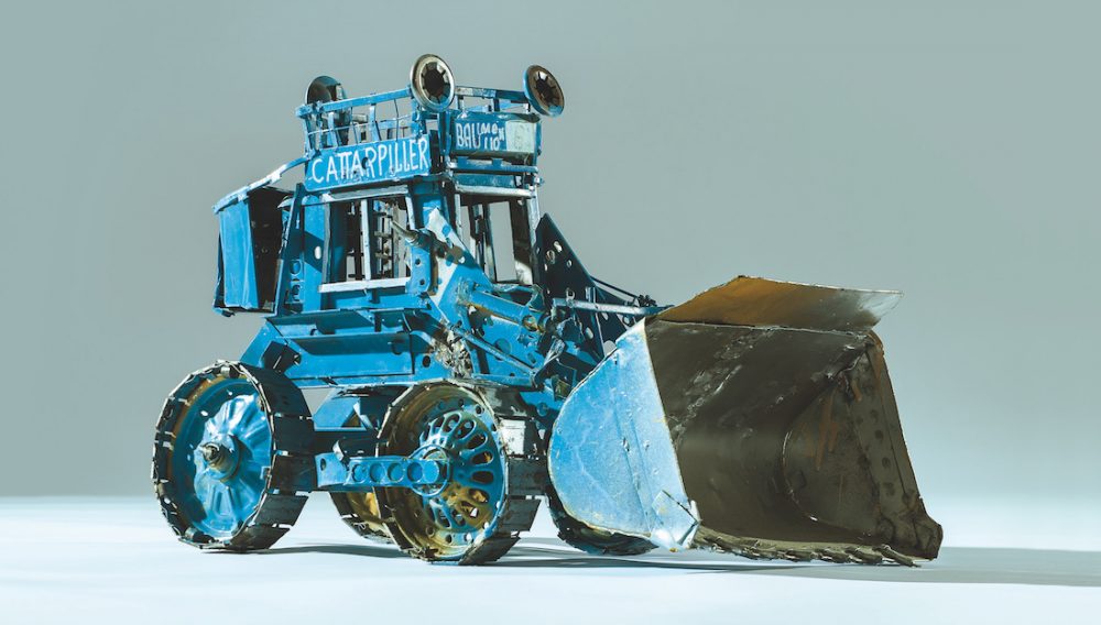 model sculpture of a digger made from reclaimed metal