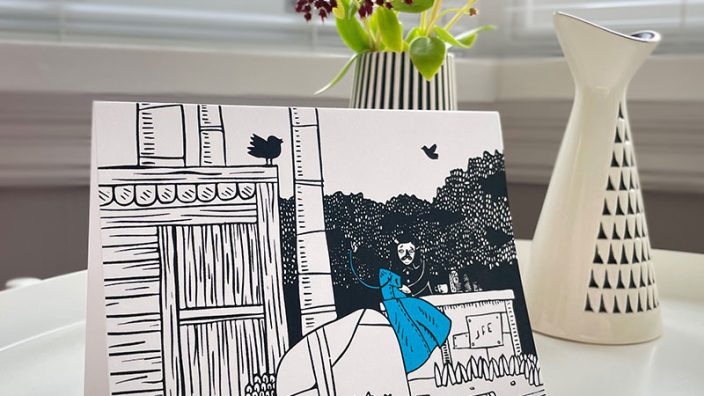 Showing Greetings card by Stewart Easton, black and white print with blue showing a figure sewing outside