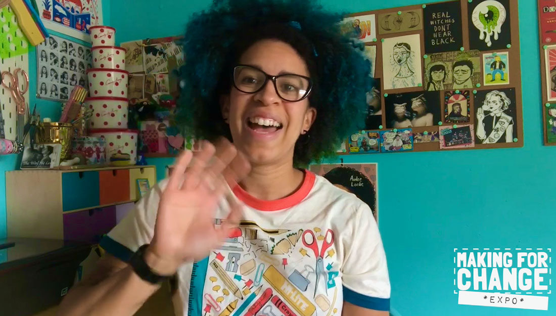 a video still of an artist waving