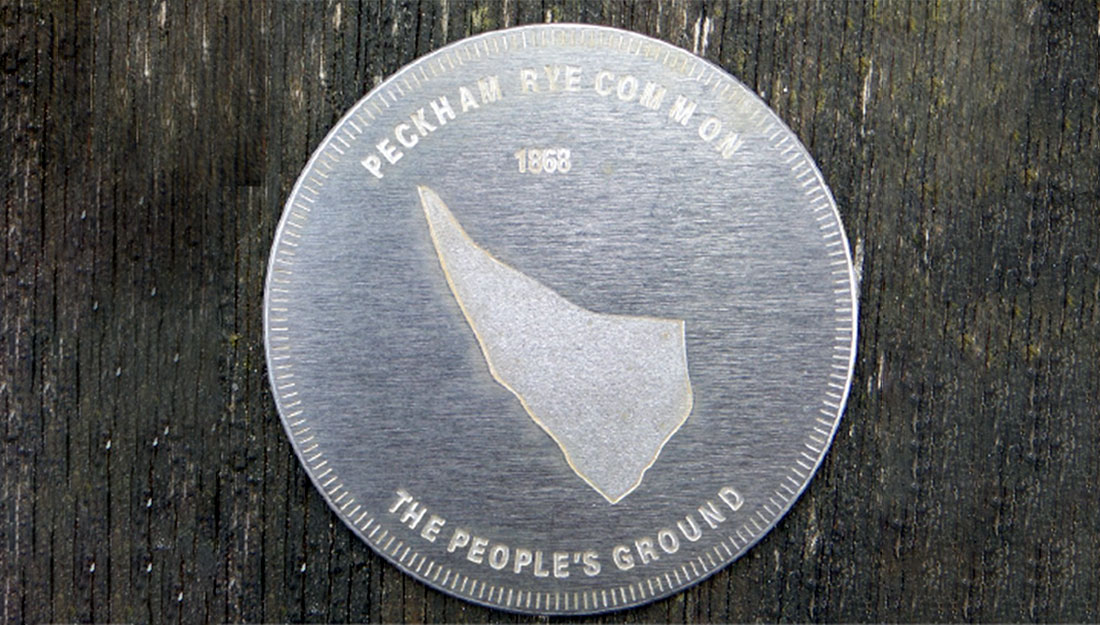 A silver token, like a big coin.