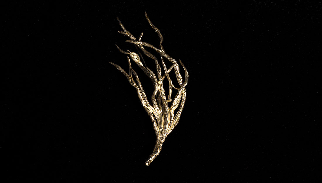 A small branch shaped brooch.