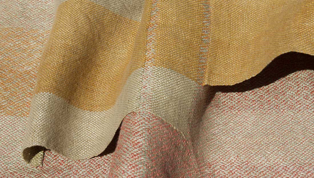 A woven fabric with muted natural tones.