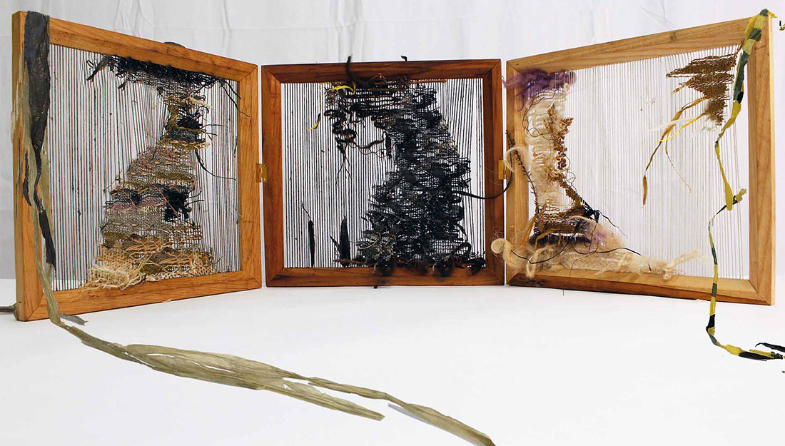 three wooden frames with absract woven pieces made from waste plastic.